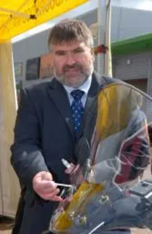 Dave Hodgson applying “smart water” to his scooter. Photo: copyright Beds Police