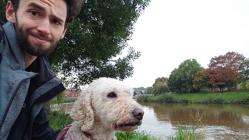 Will Aczel with dog Ayla by the River Exe, near Exeter Quay 
