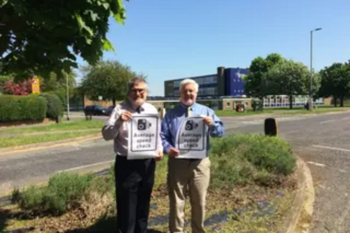 Mayor Dave Hodgson and Deputy Mayor Councillor Charlie Royden with average speed camera signs on Polhill Avenue