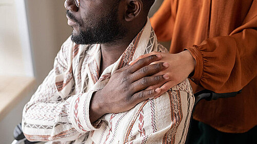 Worried person being comforted