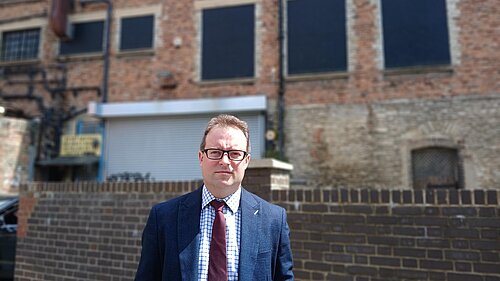 Henry Vann outside the back of Debenhams