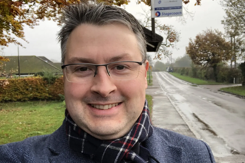 Daniel Norton at a rural bus stop in North East Bedfordshire