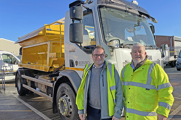 Henry Vann and Charles Royden standing next to a Gritter