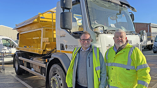 Councillors Henry Vann and Charles Royden standing in front of a gritter lorry