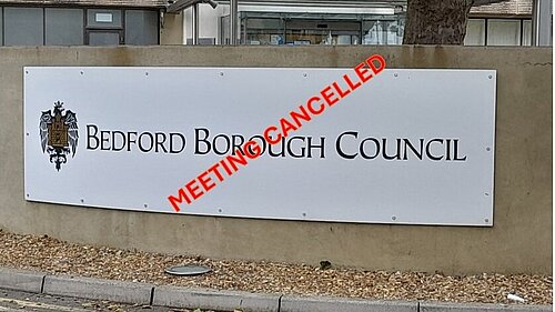 borough hall sign with meeting cancelled on it
